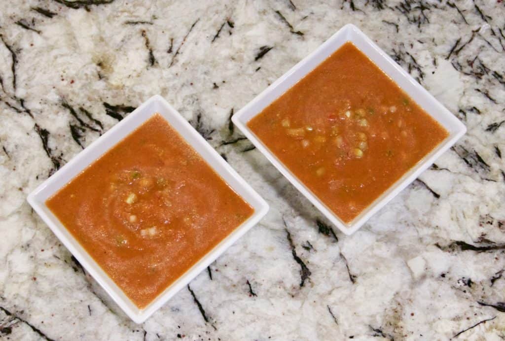 Two white bowls of Super Healthy Classic Gazpacho