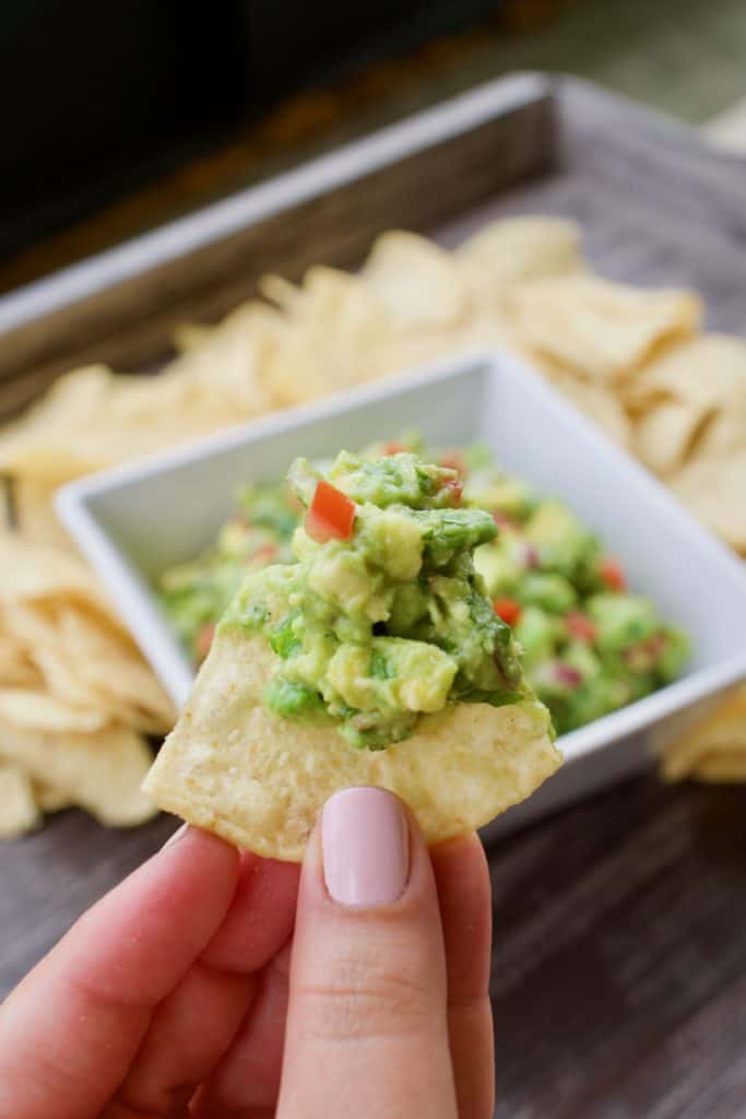 A tortilla chip with guacamole