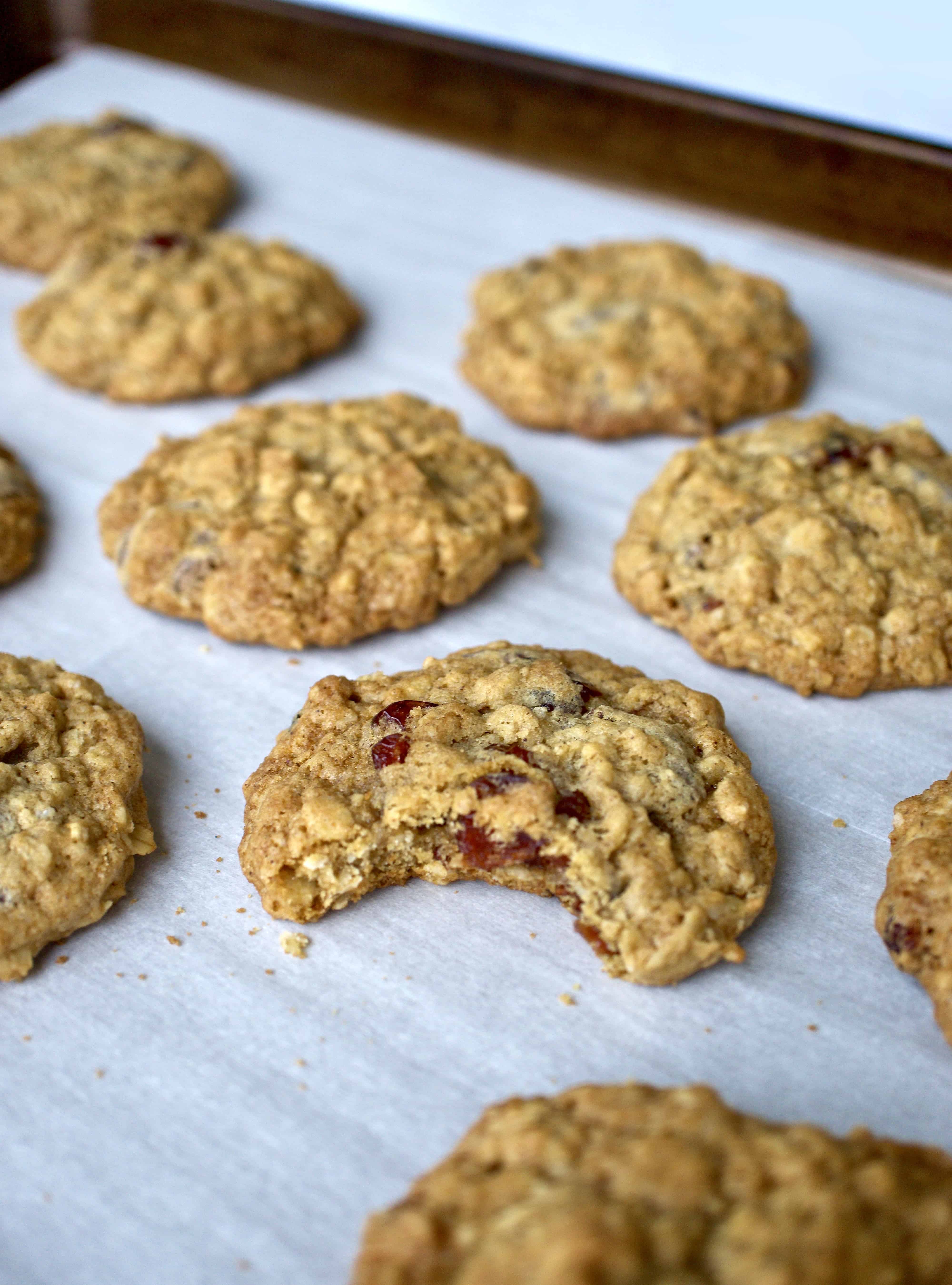 Oatmeal cranberry chocolate chip cookies on parchment paper