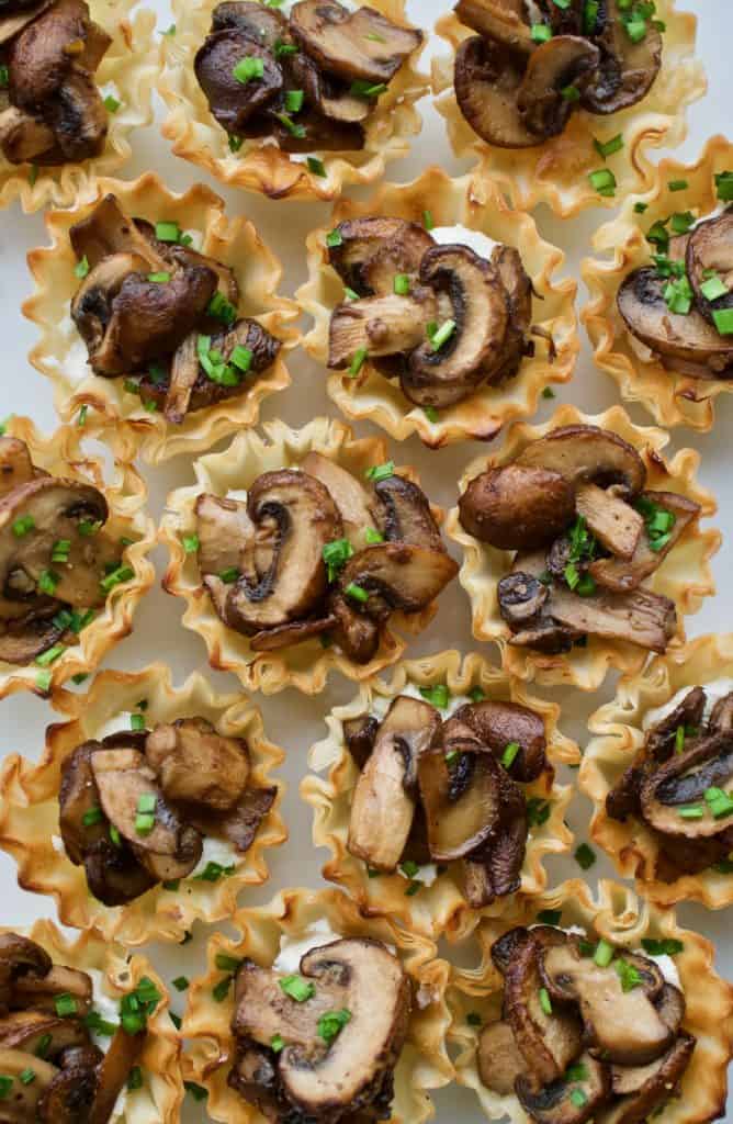 Mushroom and goat cheese phyllo bites tightly packed together