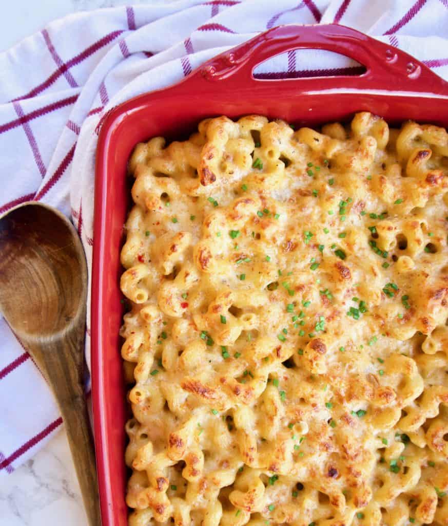 Spicy mac and cheese in a red baking dish