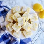 Classic lemon bars stacked on a plate