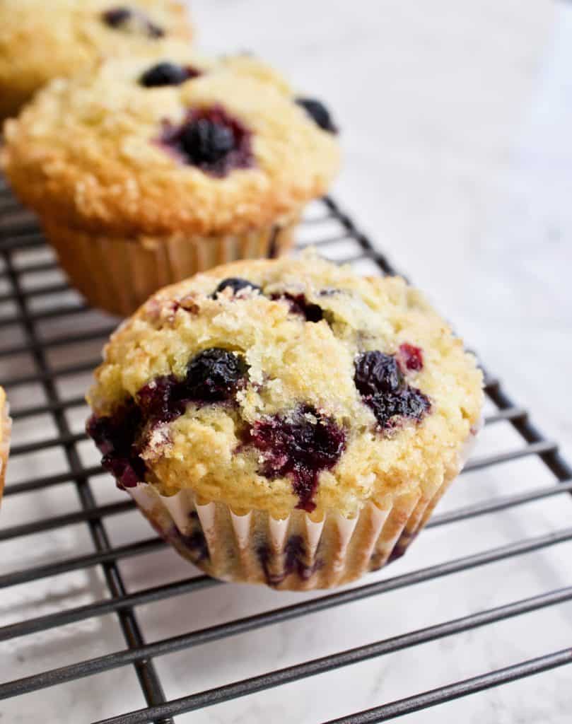 Closeup view of blueberry lemon muffin with lemon sugar topping