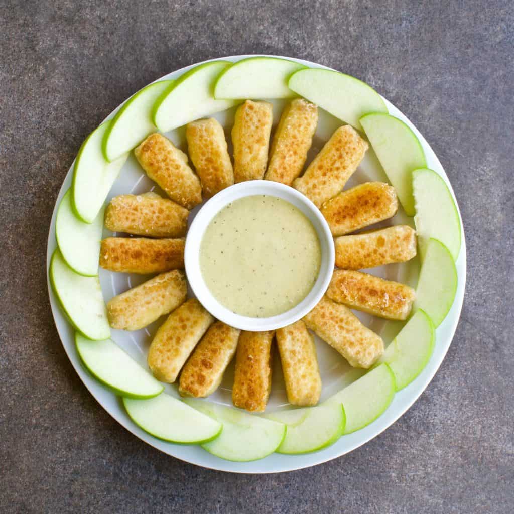 Overhead view of crispy brie spring rolls with green apple vinaigrette