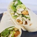Chicken caesar salad wrap cut in half and stacked together