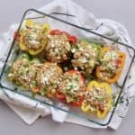 Mediterranean stuffed peppers in a glass baking dish