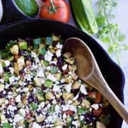 Mexican veggie skillet with wooden serving spoon