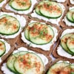 Angled overhead view of mini cucumber toasts