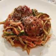 Turkey meatballs with spicy tomato sauce and zoodles on a plate