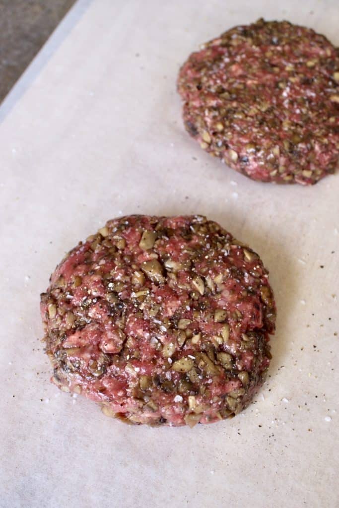 blended baby Bella and beef burger patties on parchment