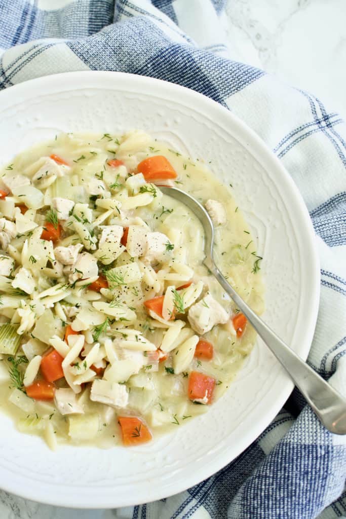 bowl of Lemon Chicken Orzo Soup with spoon
